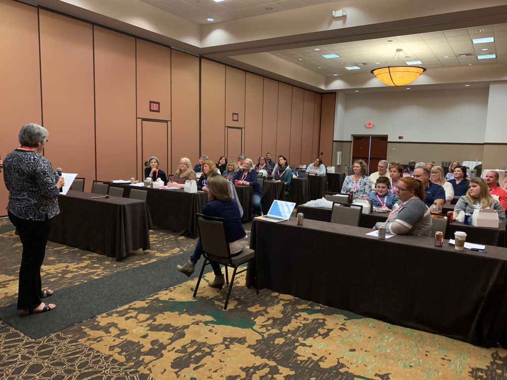 Photo of WAER members at the 2019 Annual Meeting. Trudy Stachowiak is leading the meeting. 